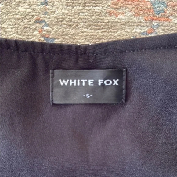 White Fox Black Fitted Top with White Stitching and Gold Zipper - Picture 2 of 4